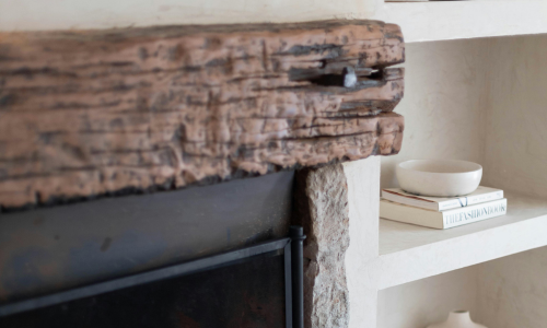 Classic Heta wood-burning stove with stone hearth installed in a Cornwall home