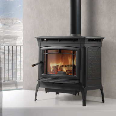 Manchester multi-fuel stove installed in a Cornwall home with stone surround and hearth
